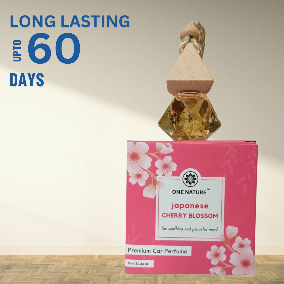 Car perfume with packaging labeled 'Japanese Cherry Blossom' and 'One Nature' brand, on a light background.