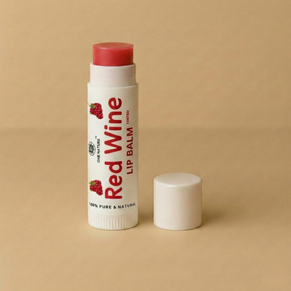 Lip balm stick labeled 'Red Wine' on a beige background