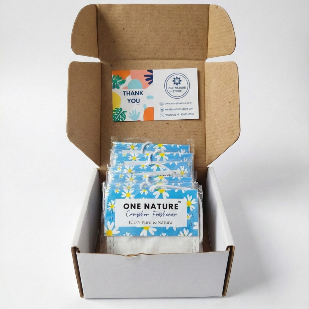 Open cardboard box containing packages labeled 'One Nature' with a business card on top.