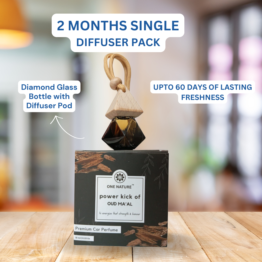 Car perfume diffuser pack with diamond glass bottle and diffuser pod on a wooden surface.