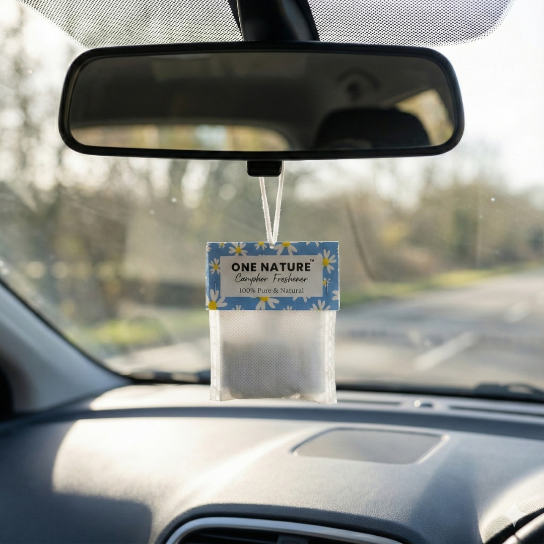 Car air freshener hanging from the rearview mirror with 'ONE NATURE' branding.