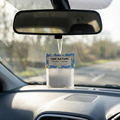 Car air freshener hanging from the rearview mirror with 'ONE NATURE' branding.