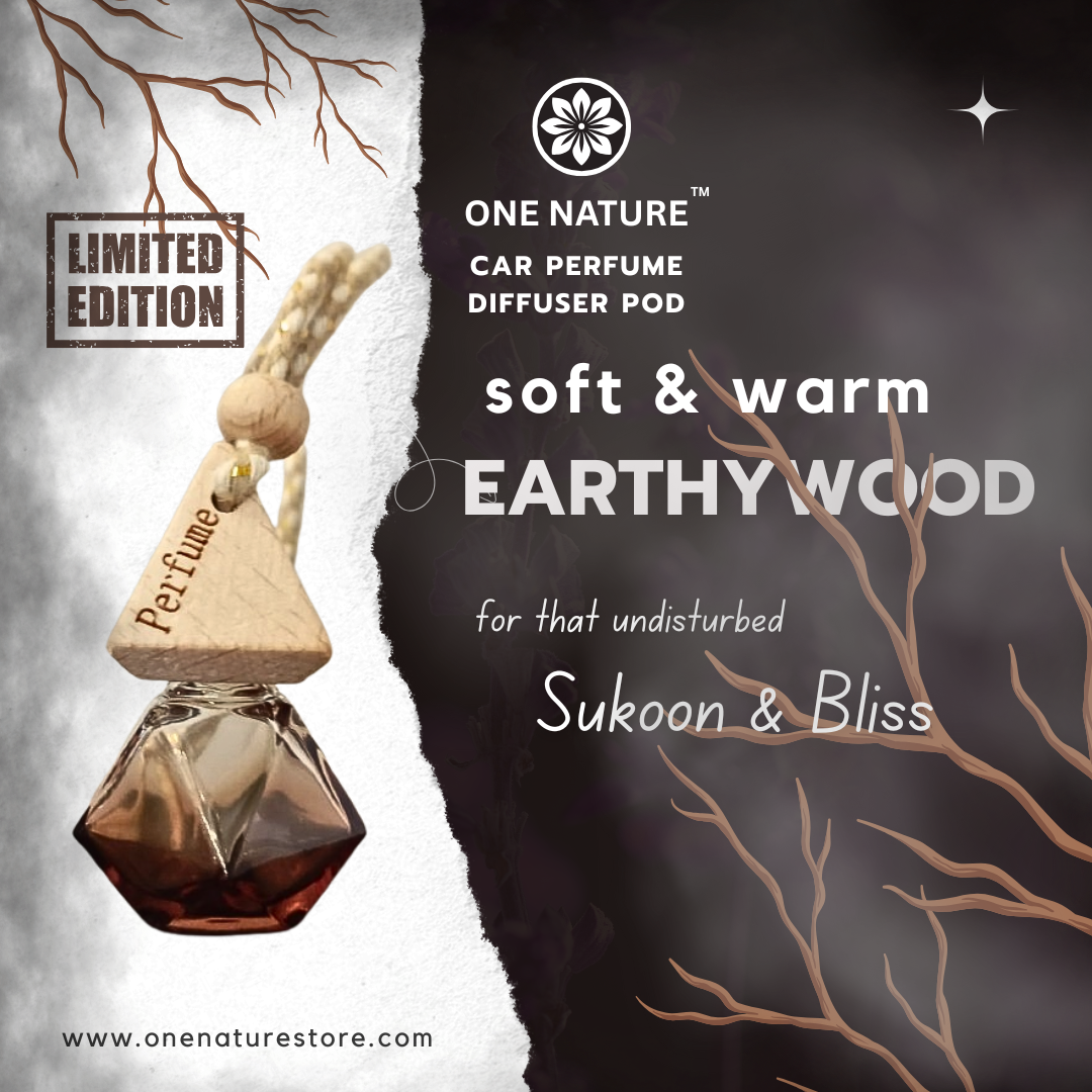One Nature car perfume diffuser pod with 'soft & warm Earthy Wood' fragrance on a dark background.