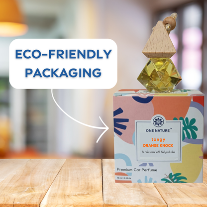 One Nature car perfume with colorful packaging on a wooden surface, labeled as eco-friendly.
