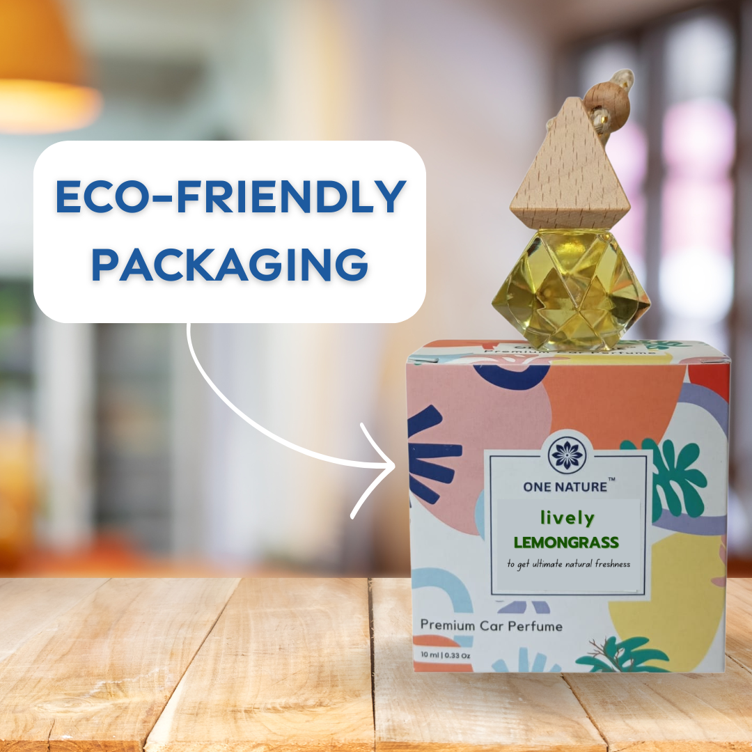 One Nature lemon grass car perfume with eco-friendly packaging on a wooden surface.