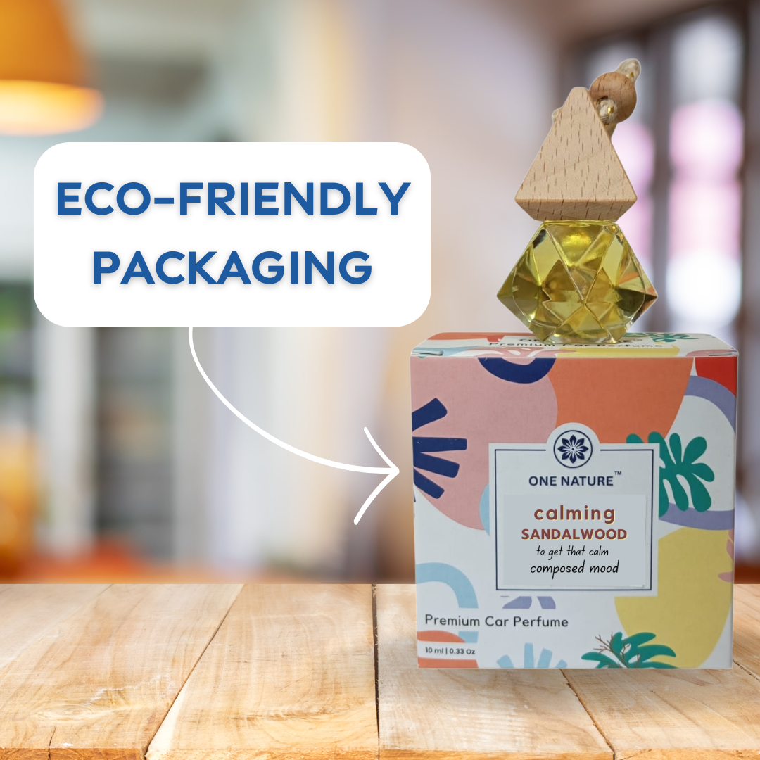 One Nature calming sandalwood car perfume with colorful packaging on a wooden surface.