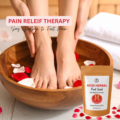 Person soaking feet in a wooden bowl with rose petals, next to a package of rose herbal foot soak.