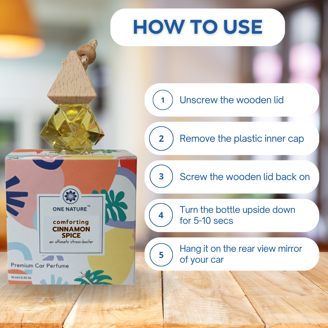 Car perfume bottle with usage instructions on a wooden surface