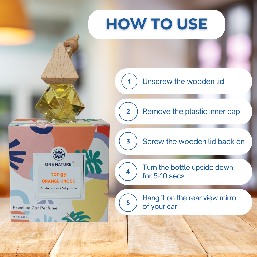 Car perfume bottle with usage instructions on a wooden surface