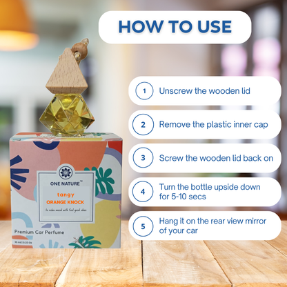 Car perfume bottle with usage instructions on a wooden surface