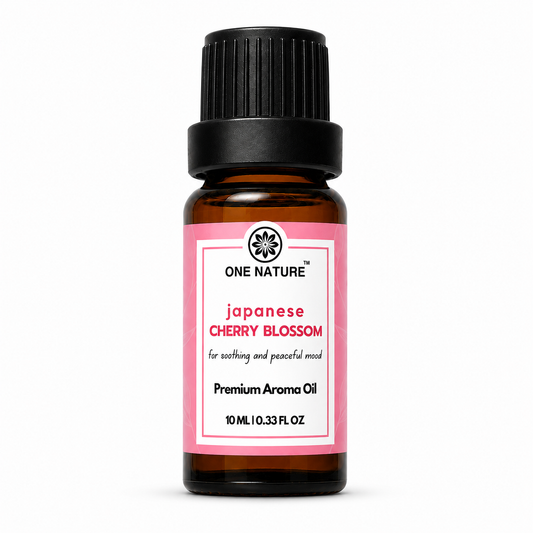 A 10 mL amber glass bottle of One Nature Japanese Cherry Blossom premium aroma oil with a black ribbed cap and a pink and white label, set against a plain white background.
