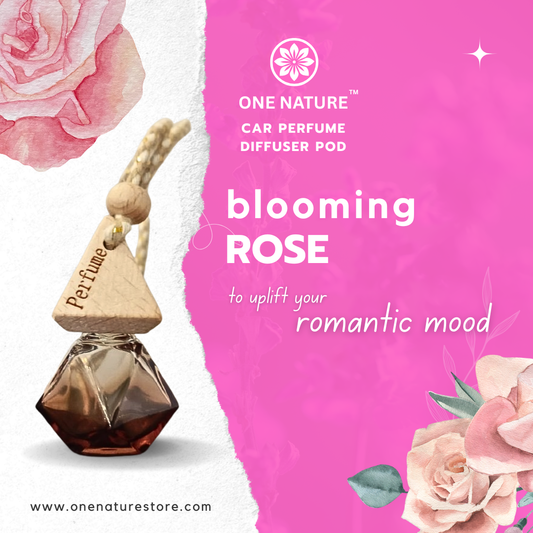 One Nature Car Perfume Diffuser Pod with 'Blooming Rose' fragrance on a pink background with roses.