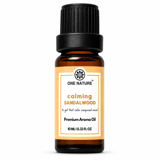 A 10 mL amber glass bottle of One Nature Calming Sandalwood Premium Aroma Oil with a black ribbed cap and a white label with orange accents, set against a plain white background.