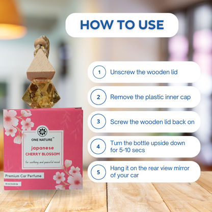 Car perfume bottle with wooden lid and pink packaging, accompanied by usage instructions.