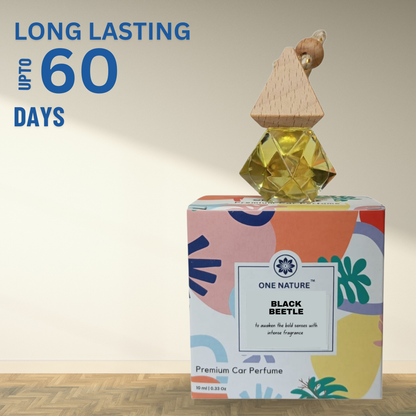 Car perfume with geometric design and colorful packaging on a wooden surface.