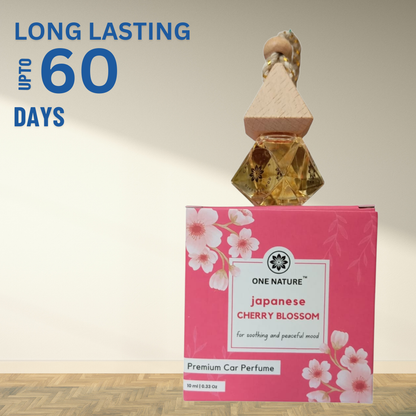 Car perfume with packaging labeled 'Japanese Cherry Blossom' and 'One Nature' brand, on a light background.